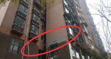 二楼外墙上多了18个洞 楼上144户业主:安全隐患担忧不已